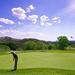 Golf course with mountainous backdrop