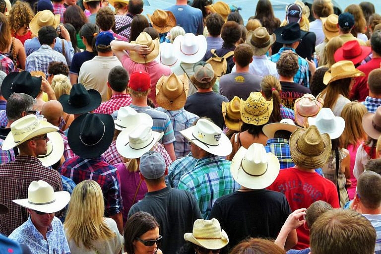 A crowd of people wearing cowboy hats at the Calgary Stampede