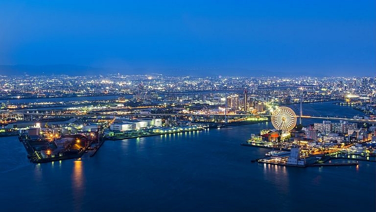 Port of Osaka illuminated at night.